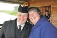  ??  ?? Calum MacDougall, piper, and Riona Whyte, organiser, are all smiles despite the rain. 29_t29 morvern 5