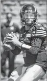  ?? CP PHOTO ?? Hamilton Tiger-Cats quarterbac­k Johnny Manziel looks for an open receiver during second half preseason CFL action against the Montreal Alouettes in Montreal on Saturday, June 9.