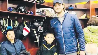  ??  ?? Victoria-based coach Justin Isaac has been coaching young hockey players in Beijing.