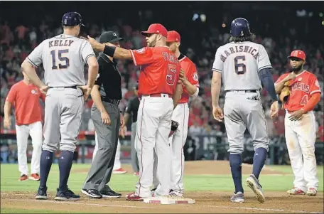  ?? Wally Skalij Los Angeles Times ?? ALBERT PUJOLS argues with players in the Astros’ dugout during Tuesday’s game. At 39, Pujols may have lost a step, but heads-up base running Monday night showed his experience. “He’s one of the smartest guys we have,” shortstop Andrelton Simmons said.