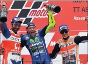  ?? Picture: AP PHOTO ?? DUTCH TREAT: Valentino Rossi (centre) celebrates with Danilo Petrucci and Marc Marquez.