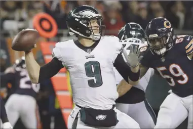  ?? The Associated Press ?? Philadelph­ia Eagles quarterbac­k Nick Foles (9) passes during the first half of an NFL wild-card playoff game against the Chicago Bears on Sunday in Chicago.The Eagles won 16-15 and will now face the New Orleans Saints this Sunday.