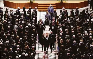  ?? Evan Vucci / Associated Press ?? The escorted casket of former Secretary of State Madeleine Albright is taken out of the Washington National Cathedral, after a funeral service on Wednesday.