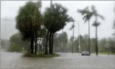  ?? ALAN DIAZ — THE ASSOCIATED PRESS ?? Heavy rains flood the streets in the Coconut Grove area Miami on Sunday during Hurricane Irma. in