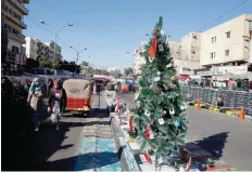  ?? — Reuters ?? A Christmas tree is seen during ongoing anti-government protests in Baghdad.