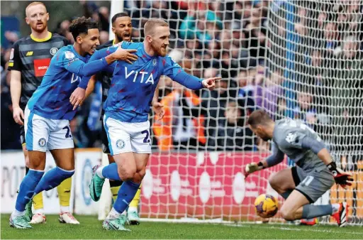  ?? Mike Petch ?? ●●Connor Evans celebrates after scoring County’s equaliser in the 1-1 draw against Harrogate at Edgeley Park