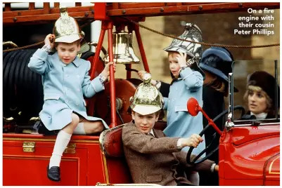  ??  ?? On a fire engine with their cousin Peter Phillips