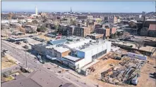  ?? MORRIS/THE OKLAHOMAN] ?? The future site of a boutique hotel is shown in the lower right corner of this December photo next to the home of Elk Valley Brewing at 1212 N Hudson Ave.[DAVE