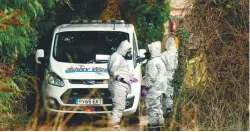  ??  ?? British military personnel in protective coveralls work to remove a vehicle near Middle Winterslow on Monday as part of the probe into the nerve agent attack.