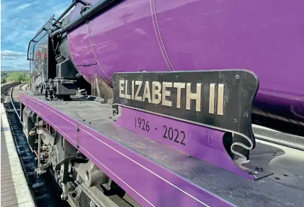  ?? DAVID BISSETT/SVR ?? As a mark of respect following the death of Queen Elizabeth II, the Severn Valley Railway gave the nameplates of No. 70 Elizabeth II (in reality ‘West Country’ No. 34027 Taw Valley, which was temporaril­y renamed and painted purple in spring to mark the Queen’s Platinum Jubilee) a black background and added the years of her life 1926-2022. The loco is pictured at Bewdley in September.