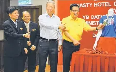  ??  ?? Lee (right) is seen during a photo-call with (from left) Ho, run organising chairman Stanley Gena, and Dynasty Hotel managing director Tony Pui.
