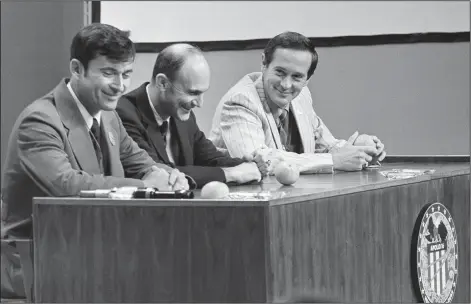  ?? (File Photo/AP) ?? Apollo 16 astronauts John Young (from left), commander; Ken Mattingly, command module pilot; and Duke, lunar module pilot, enjoy a laugh May 3, 1972, at the start of their news conference at the Manned Spacecraft Center in Houston.