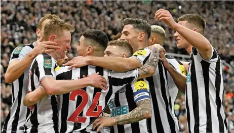  ?? (AFP) ?? Newcastle United's Sean Longstaff (L) celebrates with team-mates after scoring against Southampto­n in their English League Cup semi-final on Tuesday