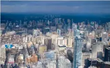  ??  ?? During winter, dark clouds hover over Toronto’s skyline, as seen     
   
 $
+ "  %