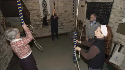  ??  ?? The group practice their bell-ringing at St Mary’s Church in Blessingto­n.