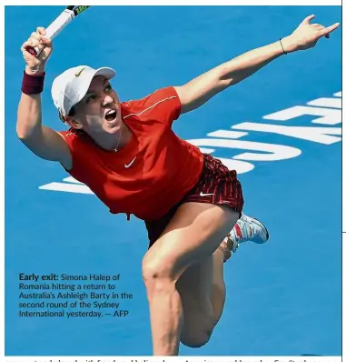  ?? — AFP ?? Early exit: Simona Halep of Romania hitting a return to Australia’s Ashleigh Barty in the second round of the Sydney Internatio­nal yesterday.