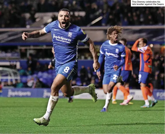  ?? ?? Troy Deeney celebrates his late leveller against the Swans