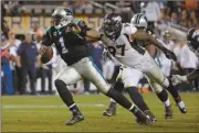  ?? Matt York/AP ?? Carolina Panthers’ Cam Newton (1) is chased by Denver Broncos’ Malik Jackson (97) during the second half of the Super Bowl.