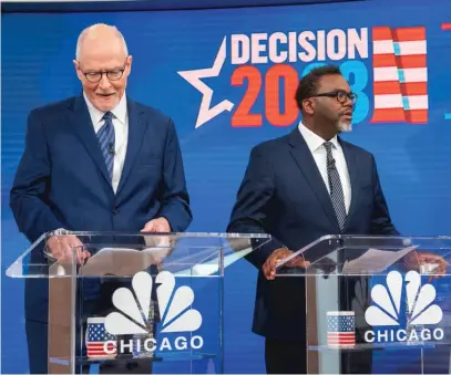  ?? ?? Mayoral candidates Paul Vallas (left) and Brandon Johnson prepare for their first debate of the runoff campaign last week.