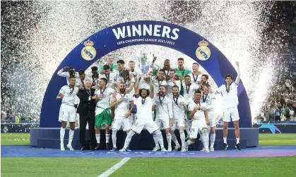  ?? ?? Real Madrid celebratin­g victory at the Champions League final in May 2022. Photograph: Rob Newell/CameraSpor­t/Getty Images