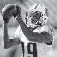  ?? ASSOCIATED PRESS FILE PHOTO ?? Tennessee Titans wide receiver Tajae Sharpe makes a catch during a game against the San Diego Chargers in San Diego in 2016. Sharpe started 10 games as a rookie last season for the Titans. Finally off the physically unable to perform list, he now finds...