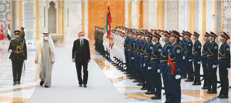  ?? WAM ?? Shaikh Mohammad Bin Zayed and Erdogan inspect a guard of honour during a reception at Qasr Al Watan Palace yesterday.