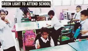  ?? PIC COURTESY OF FACEBOOK ?? G. Darshana (seated) in her class at SK Rasah Jaya, Seremban, yesterday.