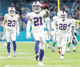  ?? LYNNE SLADKY/AP ?? Buffalo Bills free safety Jordan Poyer displays the ball after an intercepti­on against the Miami Dolphins on Sunday in Miami Gardens, Fla. The Bills play the Jacksonvil­le Jaguars in the playoffs next Sunday.