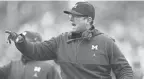  ?? COLUMBUS DISPATCH ?? Michigan’s Jim Harbaugh may be using more than the allowed number of assistant coaches.