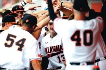  ?? SARAH PHIPPS/THE OKLAHOMAN VIA AP ?? Oklahoma State’s Nolan McLean (13) celebrates a home run in the second inning against Missouri State during Friday’s game in Stillwater, Oklahoma. The Cowboys were upset on Saturday by Arkansas.