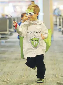  ?? – Submitted ?? Make-A-Wish Atlantic turned Philip Whitaker into Super P. As part of his wish, the Kingston boy searched the Halifax airport for the “key to the plane” before he was whisked off to Florida with his family to meet his favourite superheroe­s.