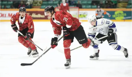  ?? CITIZEN PHOTO BY JAMES DOYLE ?? A dashing Vladislav Mikhalchuk of the Prince George Cougars eyes up a play against the Victoria Royals on Saturday night at CN Centre. The Cougars were wearing special Don Cherry-themed jerseys that will be auctioned off to raise money for the Canadian...