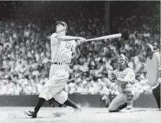  ??  ?? HANK GREENBERG hits for the Detroit Tigers in 1935.