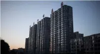  ?? AFP ?? Residentia­l buildings are seen in the Chinese city of Dandong, which lies on the North Korean border and is the top price performer for a second month in a row. —