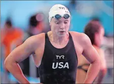  ?? MARK SCHIEFELBE­IN/AP PHOTO ?? Katie Ledecky of the United States leaves the pool after her women’s 800m heat at the World Swimming Championsh­ips on Friday.