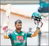  ??  ?? Tamim Iqbal of Bangladesh celebrates his century during the 3rd and final ODI match between West Indies and Bangladesh at Warner Park, Basseterre, St Kitts
on July 28. (AFP)