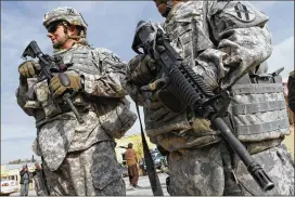  ?? AP 2009 ?? U.S. soldiers stand guard in Kabul, Afghanista­n, in 2009. U.S. officials say there are about 11,000 U.S. forces now deployed to Afghanista­n — thousands more than the 8,400 allowed under the previous administra­tion’s troop cap.