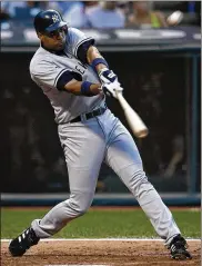  ?? RON SCHWANE / AP 2004 ?? Tony Clark with the New York Yankees hitting a two-run home run off Cleveland Indians pitcher Cliff Lee on Aug. 23, 2004, in Cleveland.