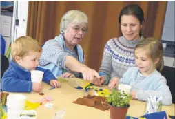  ?? FM4680283 ?? Volunteer Georgina Donaldson decorate and plant up pots with Jenny Thomas and Emily Ramsay