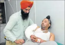  ?? BHARAT BHUSHAN/HT ?? Driver Sukhwant Singh undergoing treatment at Rajindra Hospital in Patiala on Tuesday; (right) the cash van with a flat tyre in Banur.