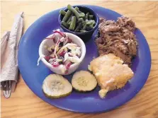  ?? COURTESY OF WREN PROPP ?? Pulled pork with green beans and purple slaw at B3: BBQ, Burgers and Beer in Las Vegas, N.M.
