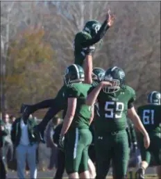  ?? PETE BANNAN — DIGITAL FIRST MEDIA ?? Ridley quarterbac­k Jack Bakey gets a lift from his offensive linemen to celebrate a first-half touchdown Thursday.