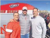  ?? STEVE VIRGEN/ JOURNAL ?? Pro football Hall of Famer Brian Urlacher, center, is seen at last week’s New Mexico Bowl with new Lobo coach Danny Gonzales, left, and athletic director Eddie Nuñez.