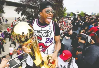  ?? FRANK GUNN/THE CANADIAN PRESS ?? Longtime Toronto Raptors guard Kyle Lowry was having a blast as his Toronto Raptors paraded the Larry O’brien Trophy through the jam-packed streets of Toronto on June 17.