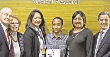  ??  ?? (From left) Ralph Nappi, Dr. Bettie Steinberg, Dr. Annette Lee, DaeQuan Morrison, Patricia Morrison and Dr. Kevin Tracey. DaeQuan has published ‘What’s the Spook’ to help young people overcome their fears.