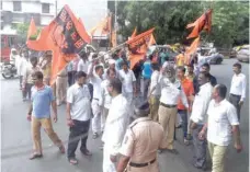  ?? — AFP ?? Members of the Maratha community in Maharashtr­a stand in front of a bus as they try to block traffic during a protest in Mumbai on Wednesday.