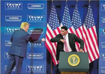  ?? JOHN BAZEMORE/AP PHOTO ?? President Donald Trump elbow bumps with Herschel Walker during a 2020 campaign rally in Atlanta.