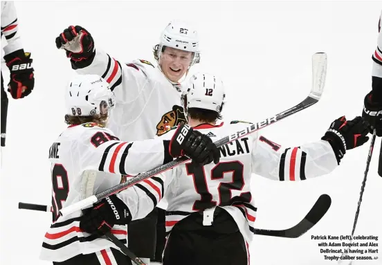  ?? AP ?? Patrick Kane (left), celebratin­g with Adam Boqvist and Alex DeBrincat, is having a Hart Trophy-caliber season.