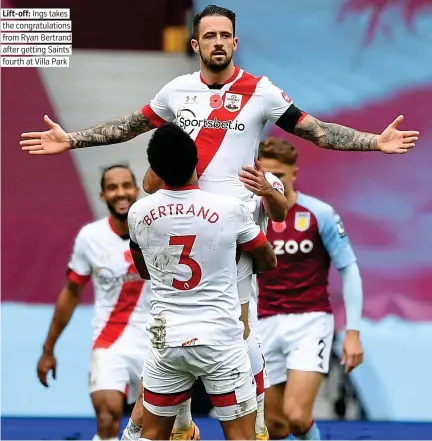  ??  ?? Lift-off: Ings takes the congratula­tions from Ryan Bertrand after getting Saints’ fourth at Villa Park
