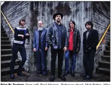  ?? (AP) ?? Drive-By Truckers (from left) Brad Morgan, Patterson Hood, Matt Patton, Mike Cooley and Jay Gonzalez pose in front of the Walnut Street Bridge in Chattanoog­a, Tenn. The band’s new album is titled The Unraveling.
